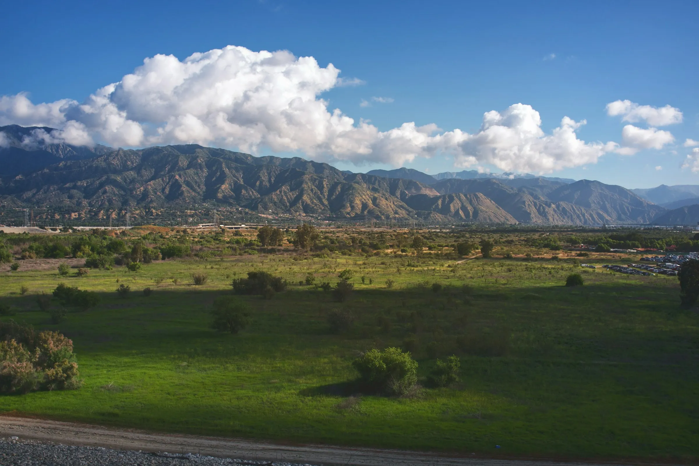 A winter road climbing through foothills country
