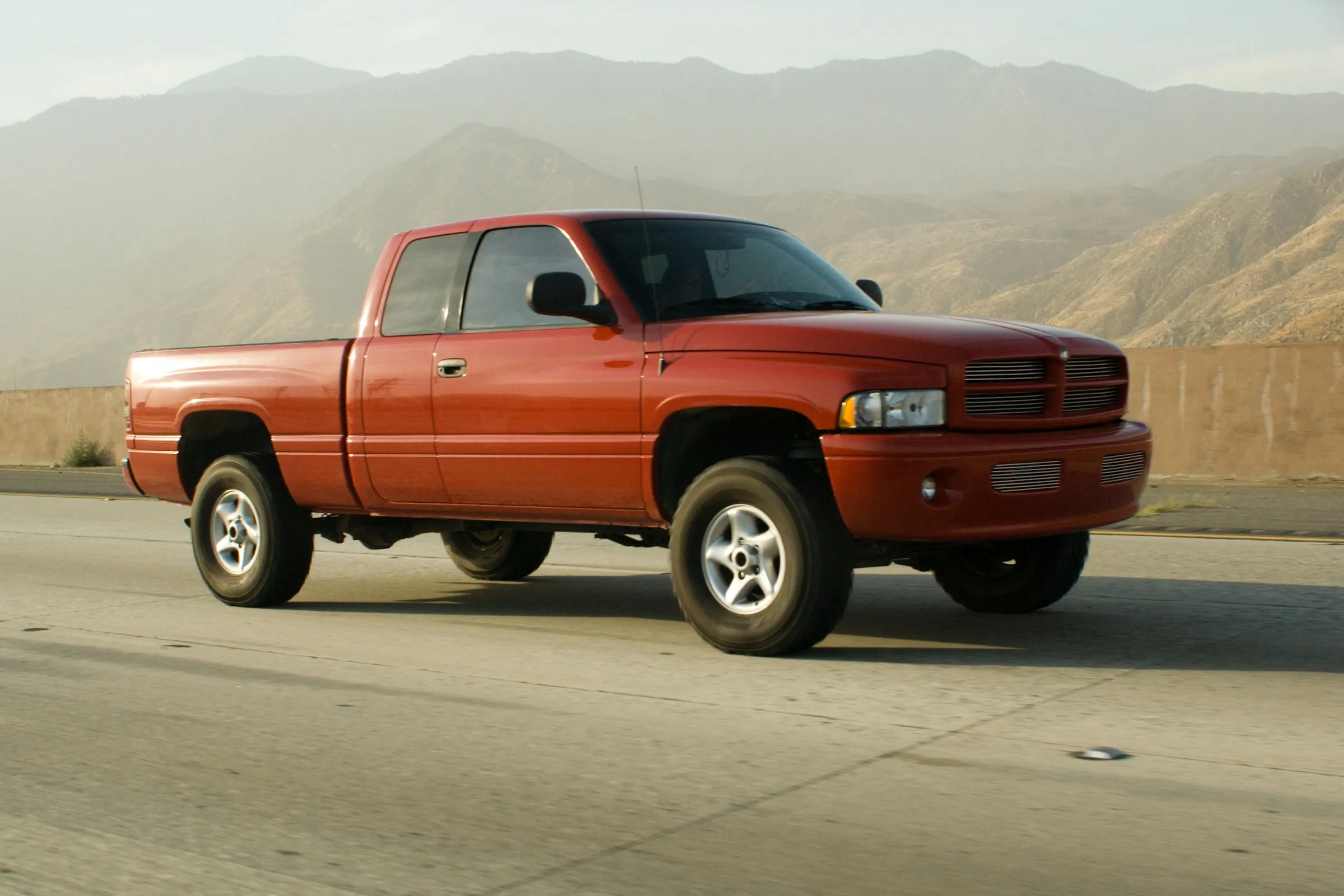 A pickup truck on a gravel road in the Foothills