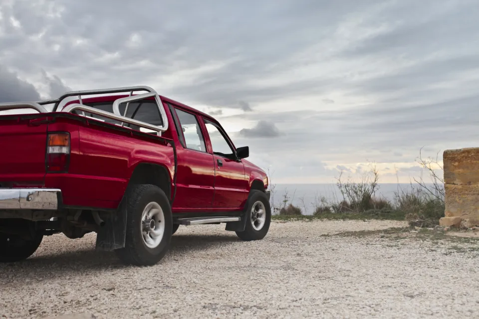 A pickup truck on a gravel road